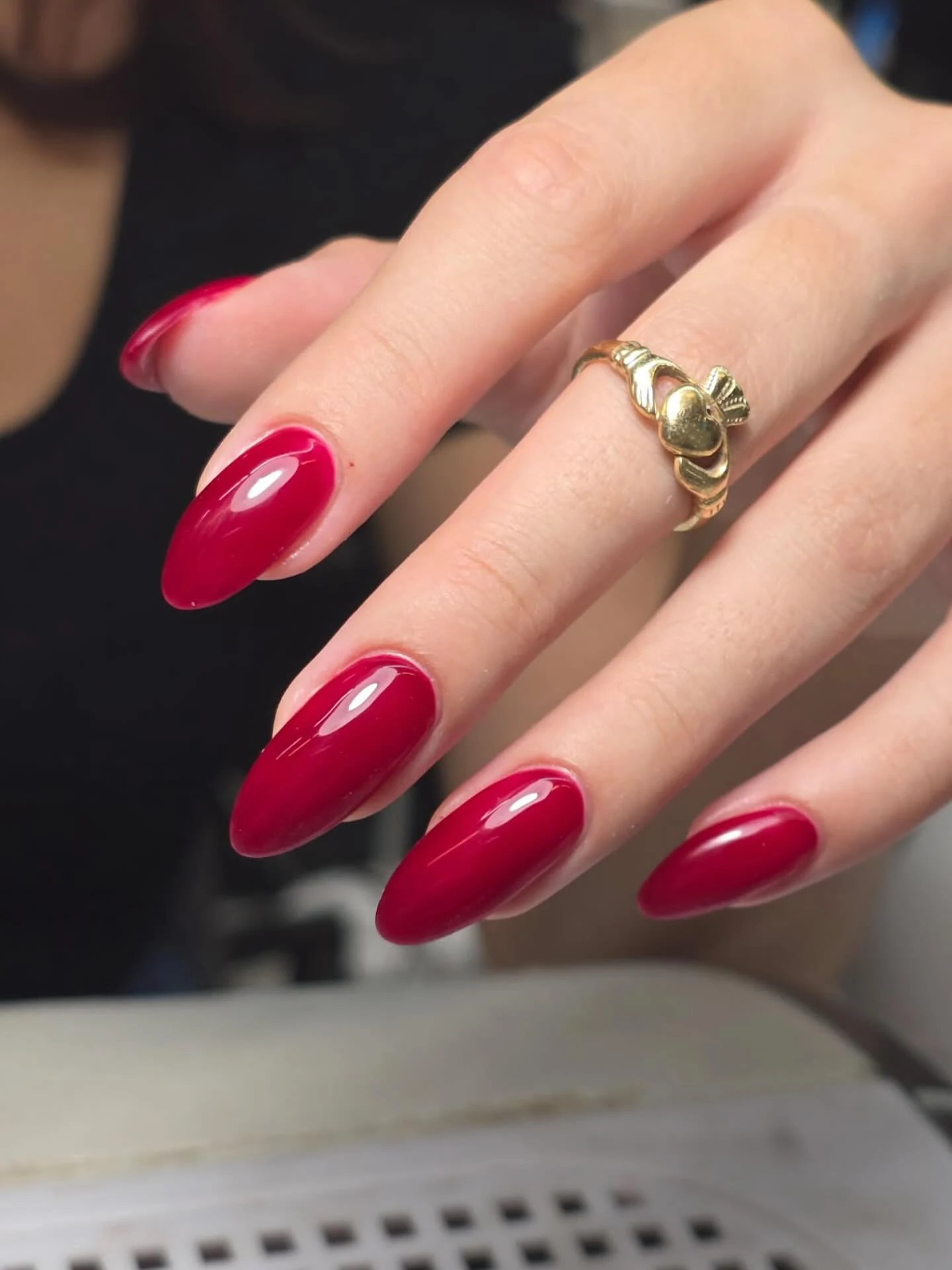 Glossy deep cherry-red almond nails