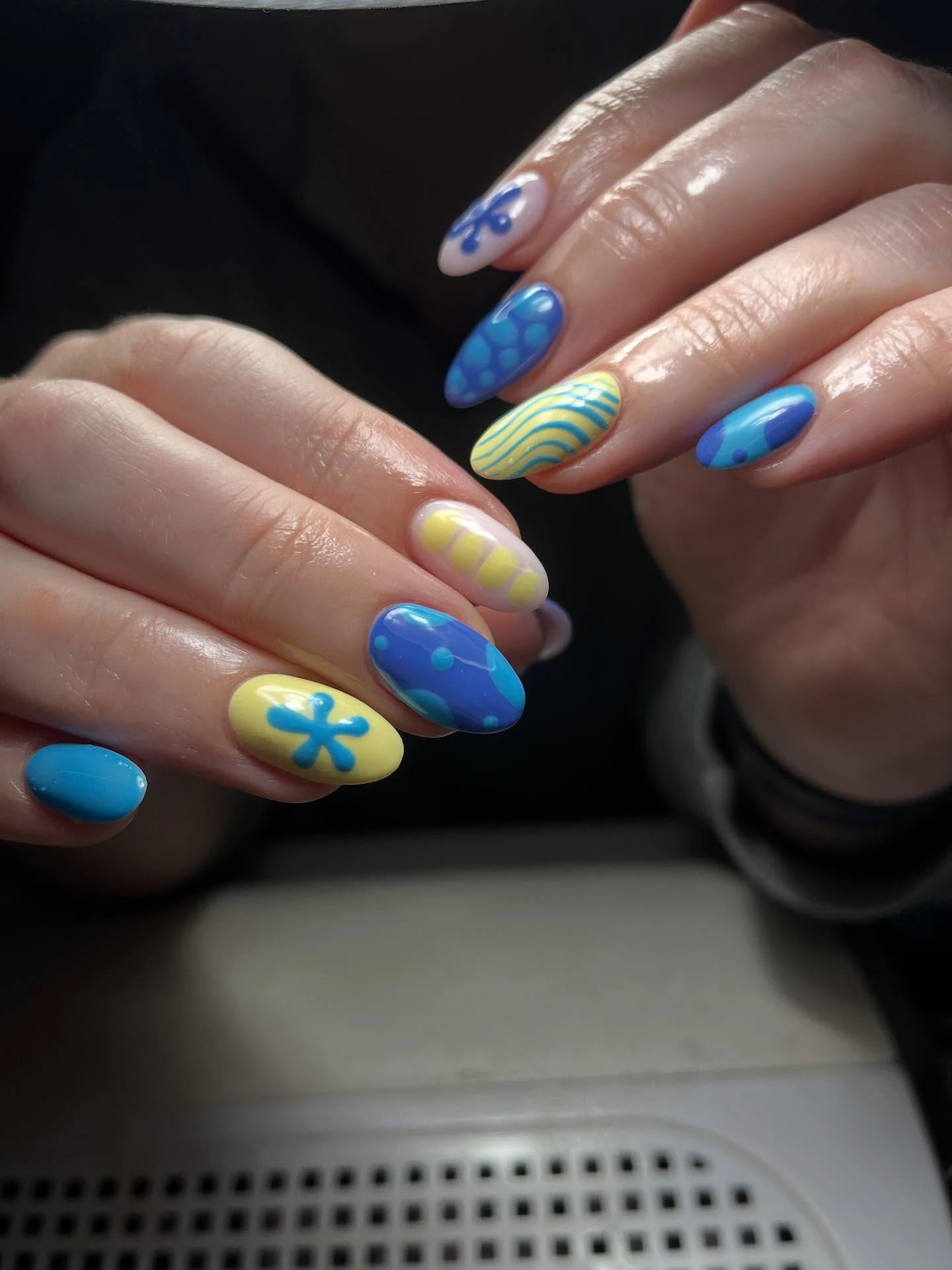 Blue and yellow abstract-art almond nails