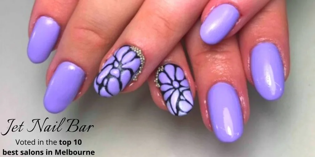 Lavender nails with hand-painted black-line white flower art