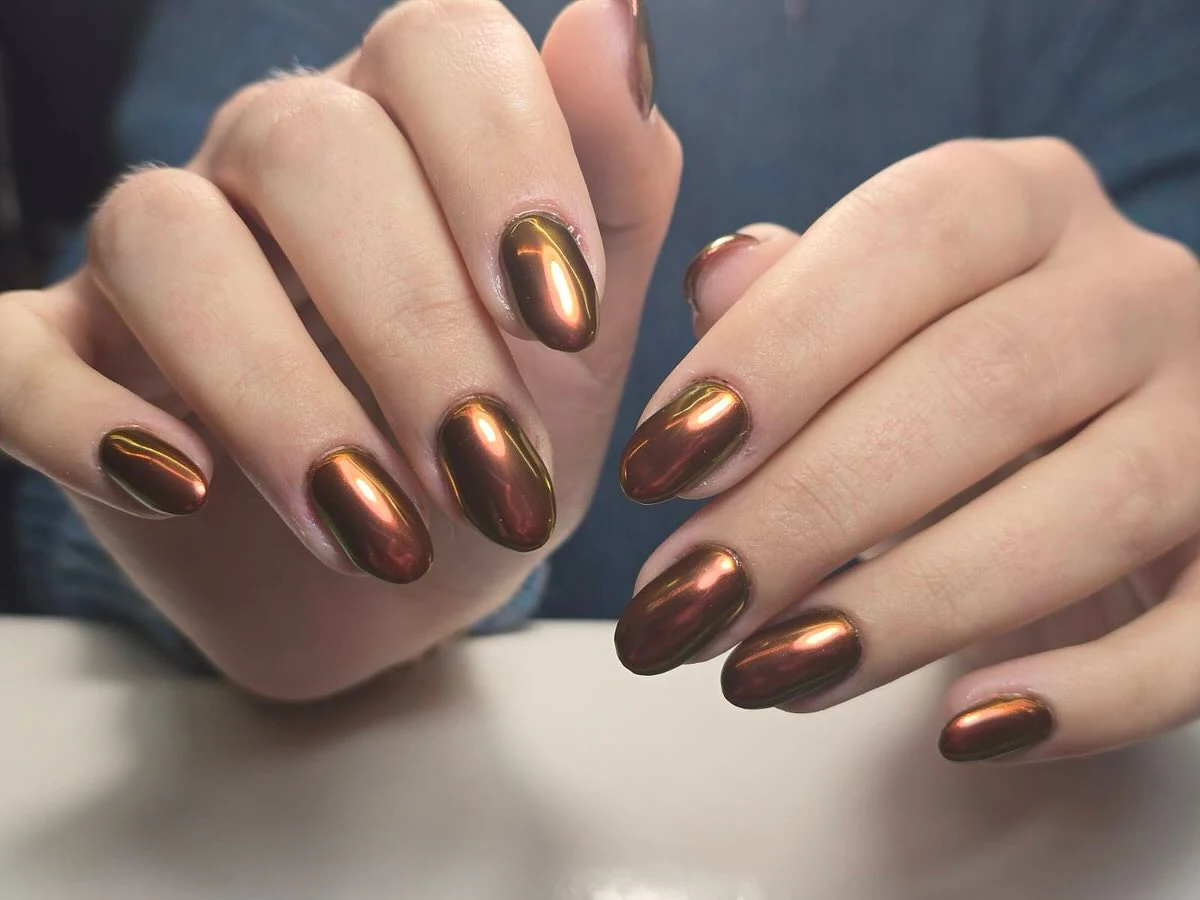 Copper mirror-chrome almond nails, glossy metallic